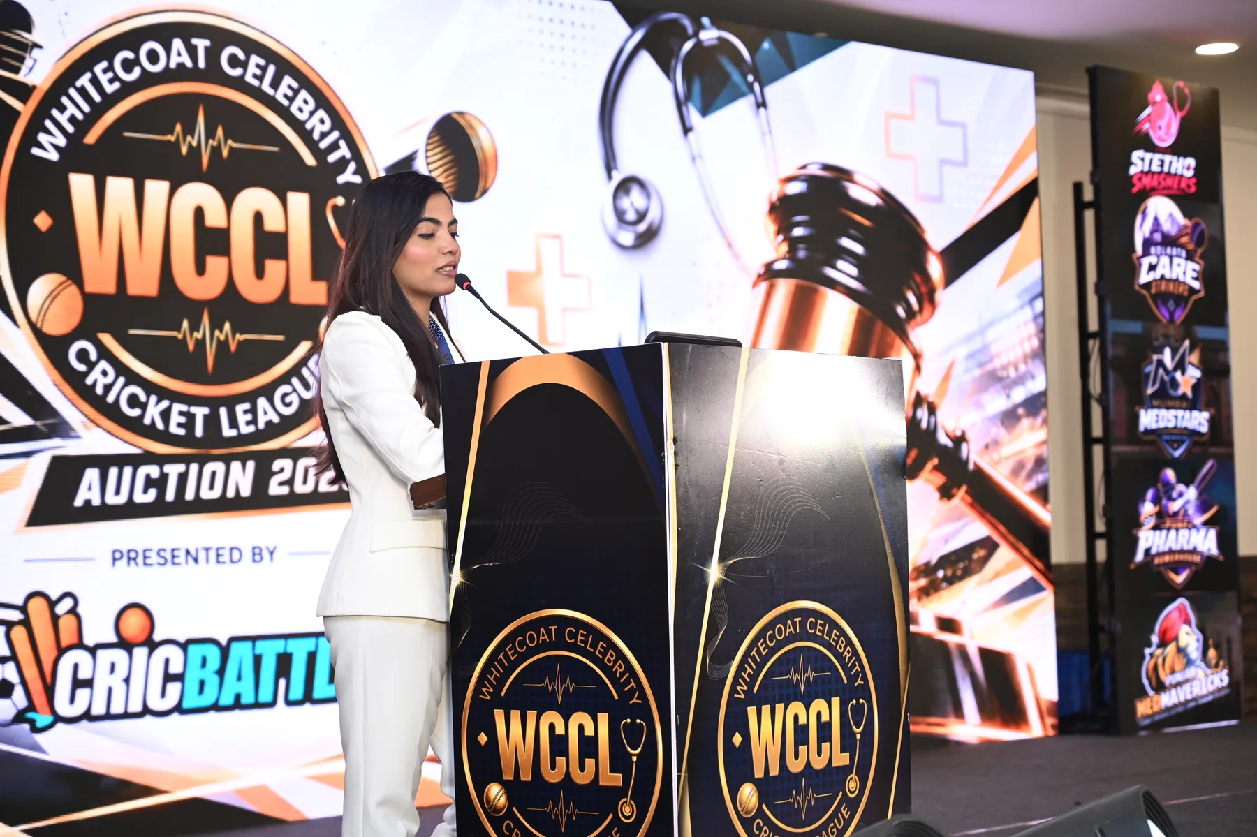 Speaker at the WCCL Grand Auction stage